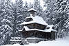 Jaszczurwka Kapelle im Schneefall Winterbild Zakopane altes Bergleutestil Foto